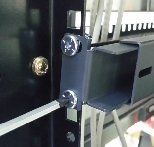 Image of screwing in the rear mount rack mounts